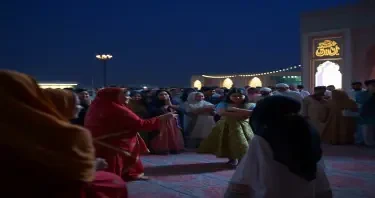 a mujrah scene where navaabs are enjoying the dance perfomance of pretty young indian girls