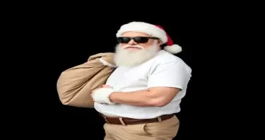 please create an image of Santa Claus in a white tee shirt and shirts wearing dark sunglasses and carrying a large bag of mail against a  flat black background