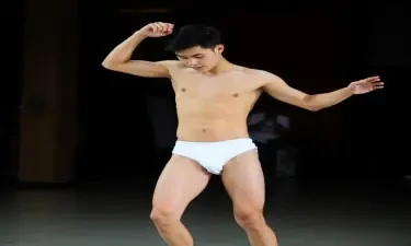 Young asian male dancing wearing only white briefs