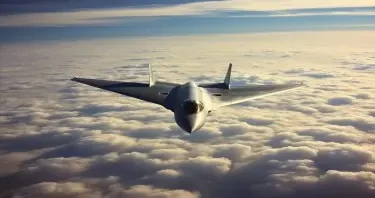 A Cold war era delta wing jet bomber flying high above the clouds seen from above